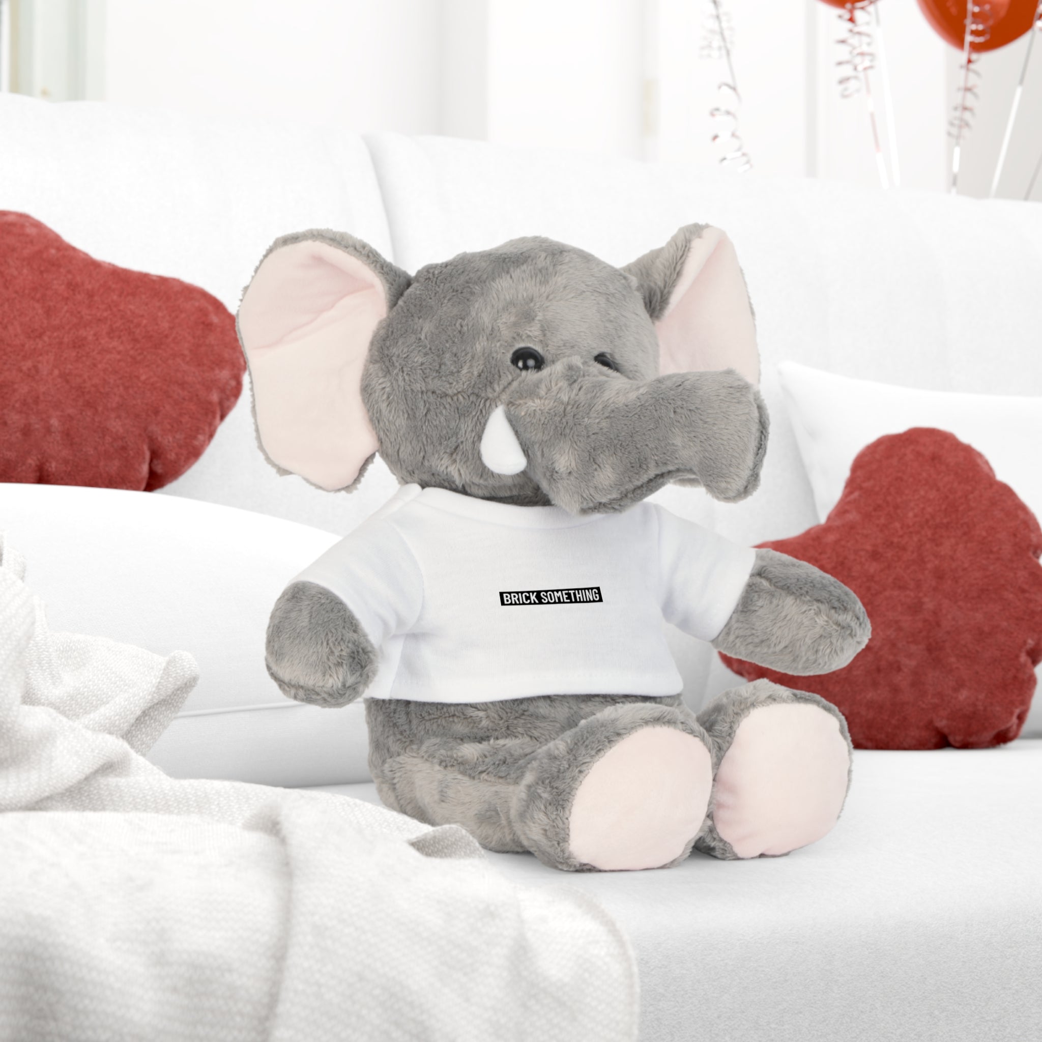 Kuscheltier mit Brick Something Schriftzug Motiv